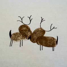 two reindeers are kissing each other in the snow