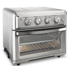 a silver toaster oven with four burners on the front and one door open