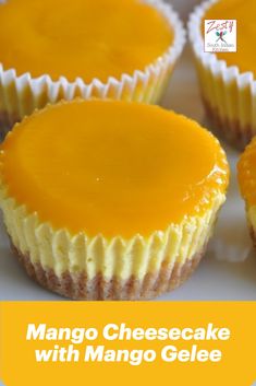 there are many cupcakes with cheese frosting on the top one is orange