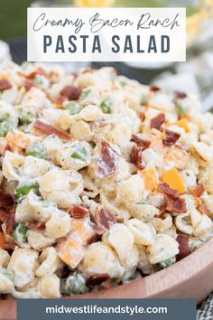 pasta salad in a wooden bowl with text overlay