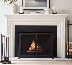 a fire place in a living room with white walls