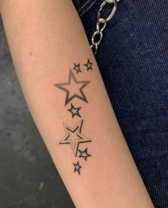 a woman's arm with stars on it