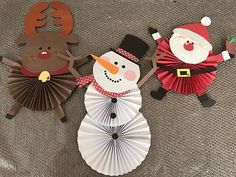 three paper snowman, santa clause and reindeer decorations