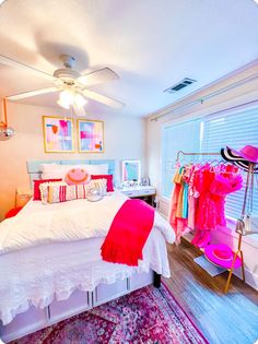 a bed room with a neatly made bed next to a window and a rug on the floor