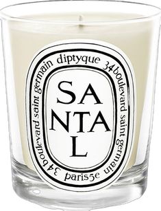 a candle that is sitting in front of a white background with the words saunta on