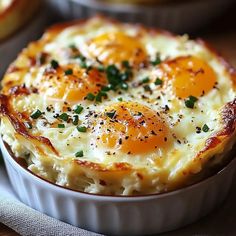 an egg and cheese casserole in a white dish