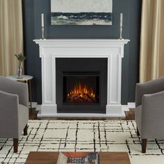 a living room with two chairs and a fire place in the middle of the room