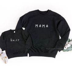 These matching sweatshirts are the perfect addition for any mama wanting to do matching mommy an daughter outfits or matching mom and son shirts. Make it extra special by adding your own custom names! *Grey sweatshirts are printed with black text ♥ABOUT OUR SWEATSHIRTS: Uptown Studio Designs uses a unisex adult Gildan brand sweatshirt. This unisex sweatshirt is preshrunk and has a classic fit. Consider ordering your regular size for a standard fit or size up if you want a roomier option. A sturd Family Matching Sweatshirt For Fall, Family Matching Fall Sweatshirt, Black Long Sleeve T-shirt For Family Matching, Family Matching Long Sleeve Sweatshirt With Name Print, Family Matching Long Sleeve Sweatshirt, Family Matching Cotton Winter Tops, Casual Winter Tops For Family Occasions, Family Cotton Sweatshirt With Letter Print, Long Sleeve Tops With Letter Print