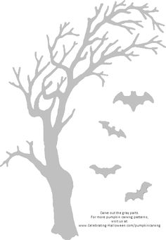 a tree with bats flying around it