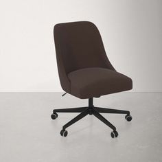 a brown office chair sitting on top of a white floor