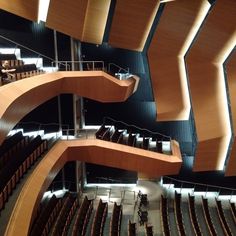 the interior of an auditorium with rows of seats