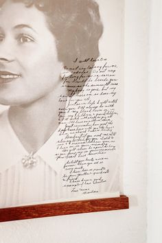 a framed photograph of a woman's profile and handwritten poem on the wall