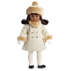 the doll is wearing a white coat and hat with fur on it's head