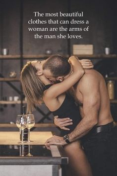 a man and woman kissing each other in front of a wine glass with the words, the most beautiful clothes that can dress a woman are the arms of the man she loves