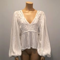 Free People Baby Doll, Long Puffy Sleeve, Crochet Top. I Have 1 Size Medium And 1 Size Xs. Brand New Without Tags. I Get Several Free People Items From My Source And Sometimes The Tags Are Not Attached And There Is A Line Through The Label In Order To Avoid Returns At Major Retail Stores. This Boho-Chic Top Looks Good With Shorts, Jeans, Skirts, And Over A Bikini. It Has A V-Neckline With Crochet Detailing And An Elastic Cuff Sleeve Bottom. Sleeve Crochet Top, Boho Chic Top, Sleeve Crochet, Doll Crochet, Retail Stores, Chic Top, Shorts Jeans, Crochet Details, Cuff Sleeves