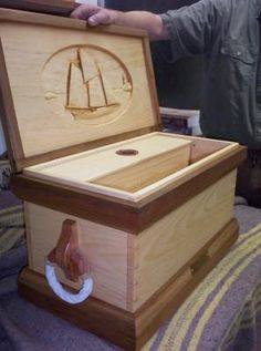 a man standing next to a wooden chest