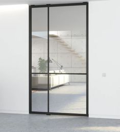 an empty room with sliding glass doors and white walls