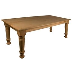 a wooden table sitting on top of a white floor