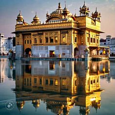 a large yellow building sitting on top of a lake