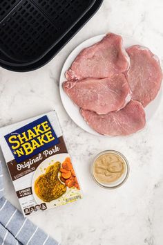 the ingredients to make shake bake sit on a marble counter top next to an air fryer