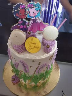 there is a birthday cake that looks like it has been decorated with cartoon characters on it