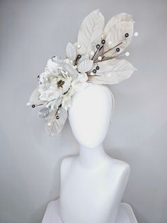 From the 2024 Featured Milliner of the Kentucky Derby Museum  Gorgeous Kentucky Derby hat fascinator  kentucky derby hat fascinator cream silver ivory leaves with metallic silver light peony flower white gray pearls and silver leaves  headband attachment each hat is totally one of a kind! no two are alike! I can probably add feathers, flowers etc to existing hats for a small fee. I cannot remove anything from existing hats. Just message me and see if we can make it work! :) I cannot make custom order from scratch. My schedule is unfortunately too crazy :( *All hats are sold as displayed. No returns do to nature of product (headwear) Of course do not hesitate to contact me with any issues :) Check out my The Hat Doctor amazing news story feature!! https://www.wdrb.com/derby_148/kentucky-der Silver Leaf Headband, Derby Hats Fascinators, Leaves Headband, Hat Fascinator, Silver Leaves, Kentucky Derby Hat, Derby Hat, Flower White, Silver Lights