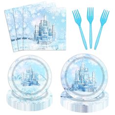 a set of four paper plates and forks with disney castle on them, in front of snow - covered background