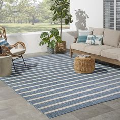 a blue and white striped rug in a living room