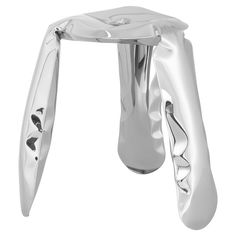 a chrome stool with curved legs and foot rest