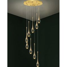 a chandelier hanging from the ceiling in a room with black walls and flooring