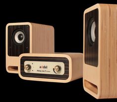 two wooden speakers sitting next to each other