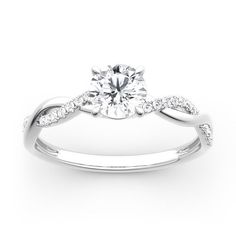 a white gold engagement ring with diamonds on it