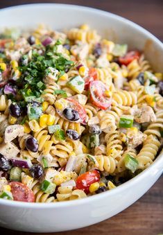 this southwest pasta salad is loaded with chicken, black olives, tomatoes, corn, and cilantro