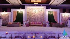 a room decorated with flowers and candles