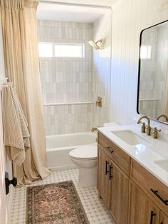 a bathroom with a rug on the floor