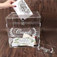 Color: Clear Features: WHAT'S INCLUDED: 6 sides of the Clear Wedding Card Box, 1 Cards Sign, 2 white stickers ("Cards" & "Thank You"), 1 Lock with 2 Keys, 1 Instruction manual. | Box Size: 10in x 9.8in x 8.5in | Sign: 5.5in x 2.8in x 0.1in. NEW VERSION: The best wedding decorations. Designed to outdo the competition! This Acrylic card box is 3.6mm thick, making it the most durable, sturdiest gift box reception on the market. Perfect for collecting gift cards from family and friends and styli Party Card Box, Acrylic Wedding Card, Graduation Card Boxes, Acrylic Card, Money Box Wedding, Fun Wedding Decor, Box With Lock, Wedding Card Box, Envelope Box