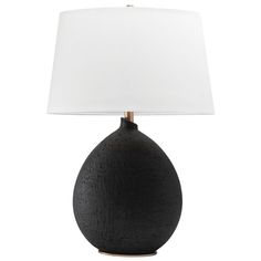 a black table lamp with a white shade