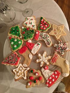 a plate full of decorated christmas cookies on a table