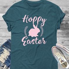 a women's t - shirt with the words hoppy easter in pink on it