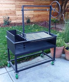 an outdoor bbq grill on wheels with potted plants in the background