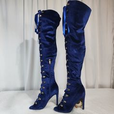 New, Never Worn Cape Robbin Navy Blue Satin Boots Has A Peep Toe Adjustable Robbin Lacing Lace Up Front 4.5" (Approx) Stiletto Heel Single Sole Boot Is 25.5" (Approx) Tall The Shaft Is 21" (Approx) Side Zip For Easy Slip On & Off Blue Fitted High Heel Knee-high Boots, Blue Pointed Toe Knee-high Boots For Winter, Blue Heeled Boots For Winter Party, Blue Thigh High Party Boots, Blue Knee-high Party Boots For Winter, Blue Knee-high Boots For Winter Party, Fitted Blue Knee-high Boots For Fall, Trendy Blue Fitted Heeled Boots, Trendy Fitted Blue Heeled Boots