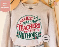 a sweatshirt with the words jolliest bunch teachers this side of the nuthouse on it