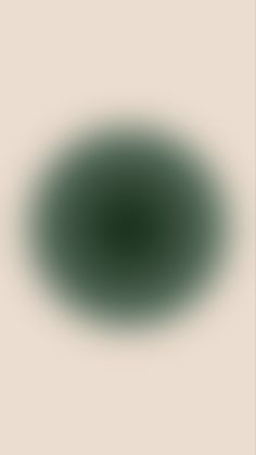 an image of a dark green spot in the middle of a white background that appears to be blurry