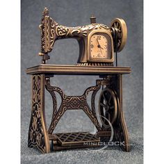 an antique sewing machine with a clock on top