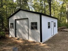 a garage in the middle of a wooded area