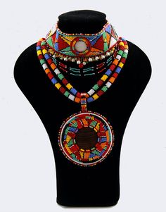 Not sure where this is from but the colors remind me of Africa. Style Africain, Fashion Traditional, African Accessories, Masai Mara, Beaded Jewels, Ethnic Necklaces, Fabric Accessories