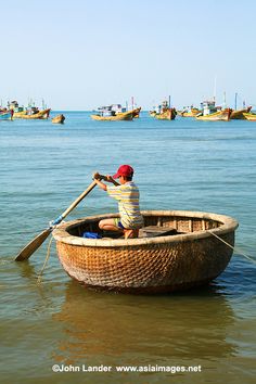 a boy in a boat on the water