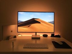 an apple desktop computer sitting on top of a desk