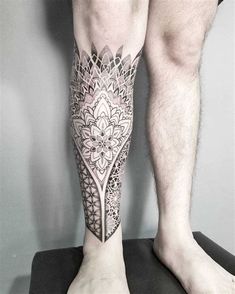 a man's leg with a tattoo on it