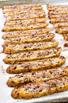 baked bread sticks lined up on a baking sheet